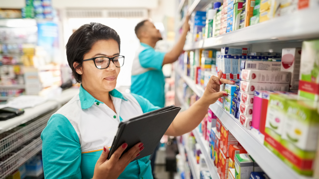 warehouse staff checking inventory using a tablet